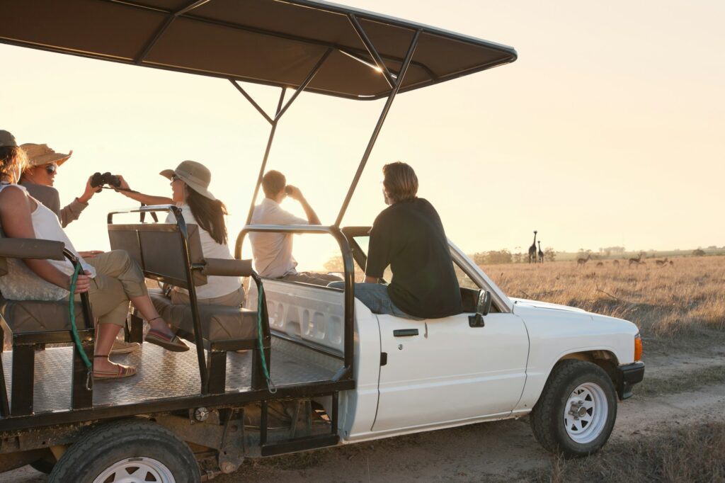 People on safari in off road vehicle, Stellenbosch, South Africa